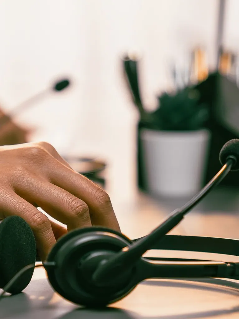Hand holding a headset